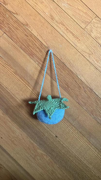Small crocheted green and blue, blueberry bag